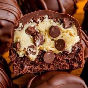 Delicious chocolate chip cookie dough brownie bombs coated in melted chocolate and sprinkled with sea salt.